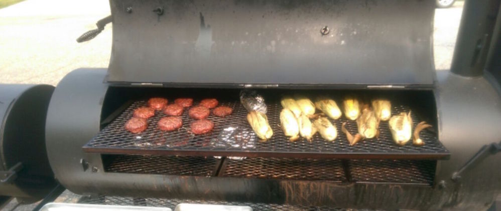 smoking ribs, hamburgers, and corn on the cob 